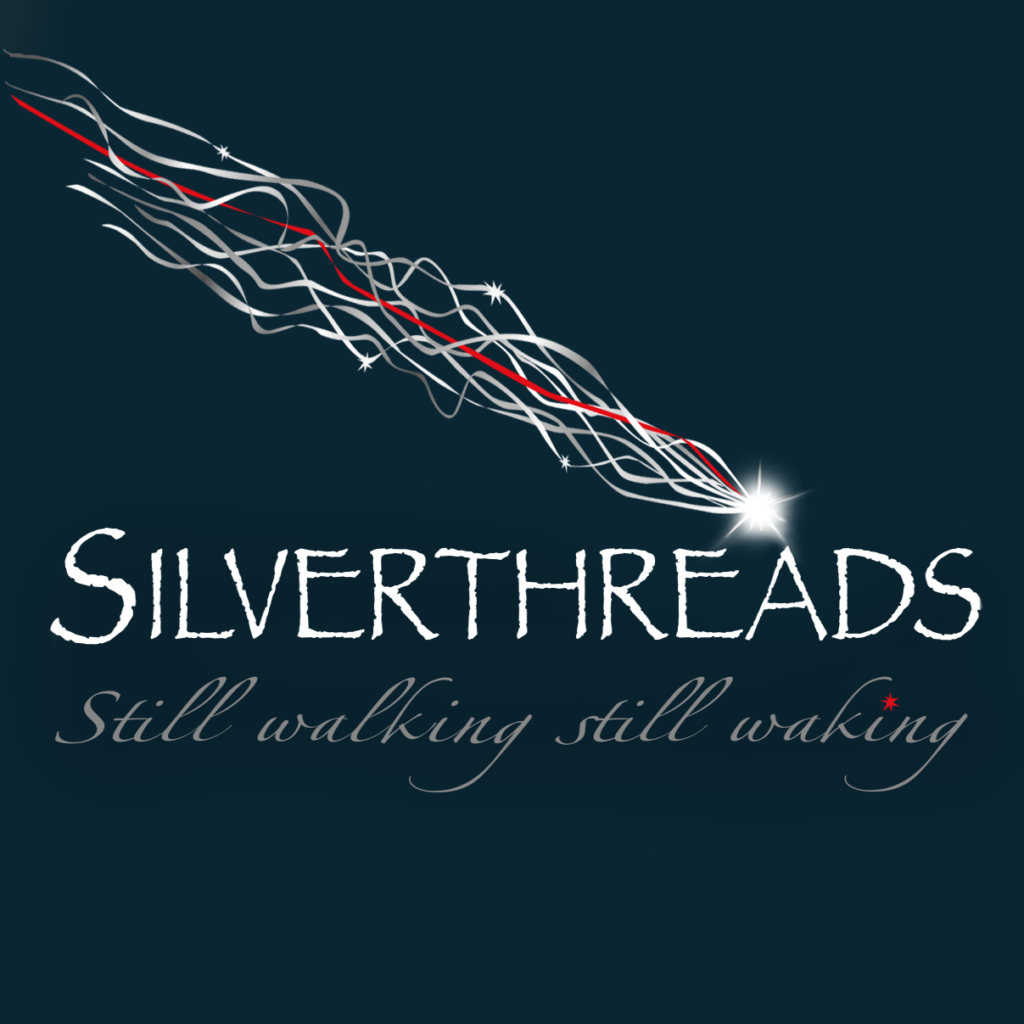 Show graphic for Silver Threads, text based logo on a dark green-blue background: "Silver Threads: Still walking, still waking" There is a bright star descending diagonally from the top left corner with a trail of silver and red threads behind it.